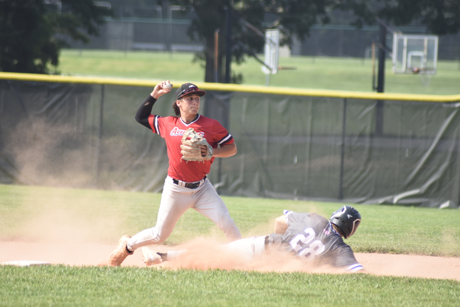 Aviators shortstop Ethan Guerra (Paris JC) turns the front end of a double play.   DREW BUDD