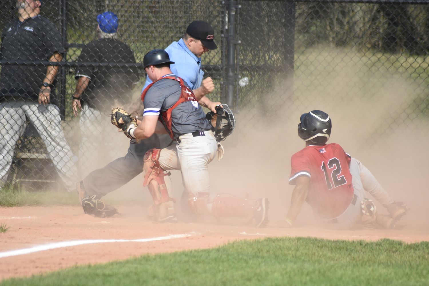 Breakers catcher Ty Gilligan (Dominican) goes to tag Aviator Luke Mistone (Cal State Fullerton) trying to score from second base. Gilligan initially dropped the ball but reapplied the tag to Mistone and got what was at the time a big out, keeping it a one-run game.  DREW BUDD