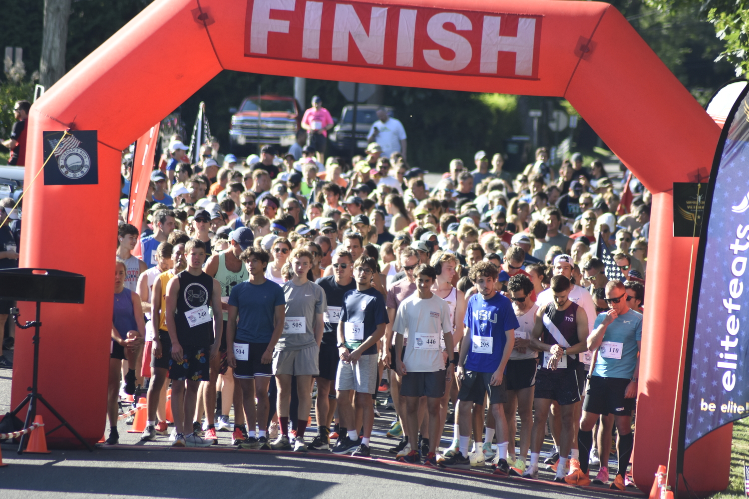 Runners gather at the start/finish line just prior to the opening gun of Jordan's Run in Sag Harbor on Sunday morning.   DREW BUDD