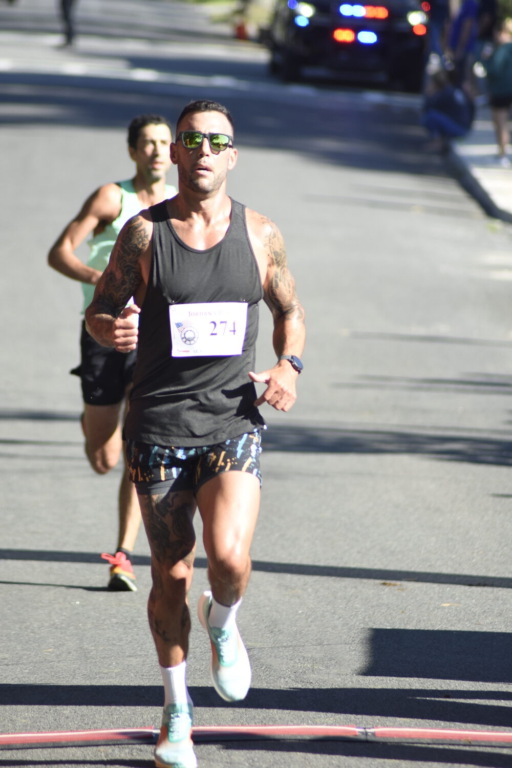 Neil Falkenhan, 39, of East Hampton placed third overall.   DREW BUDD