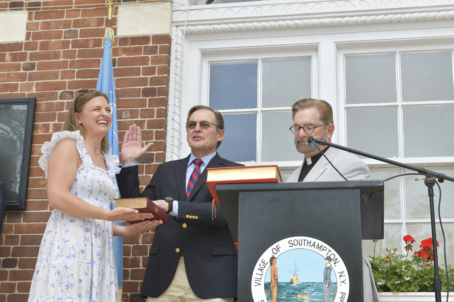 Southampton Village Trustee Roy Stevenson is sworn in by Reverend W. Patrick Edwards on Monday afternoon, as his daughter Alexandra holds the Bible.  DANA SHAW