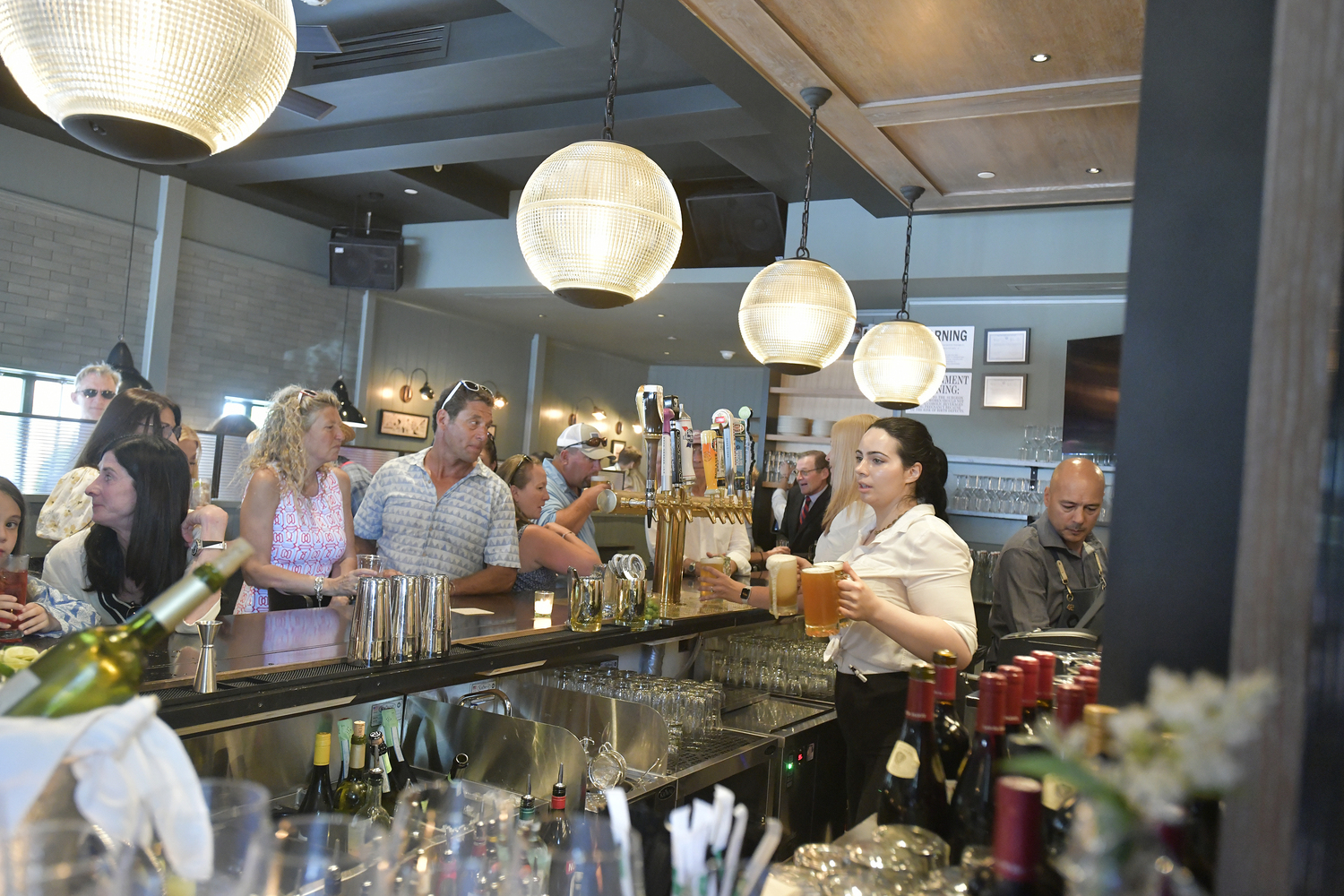 Friends and well wishers packed Shippy's restaurant in Southampton Village on July 3 after the ribbon cutting.   DANA SHAW