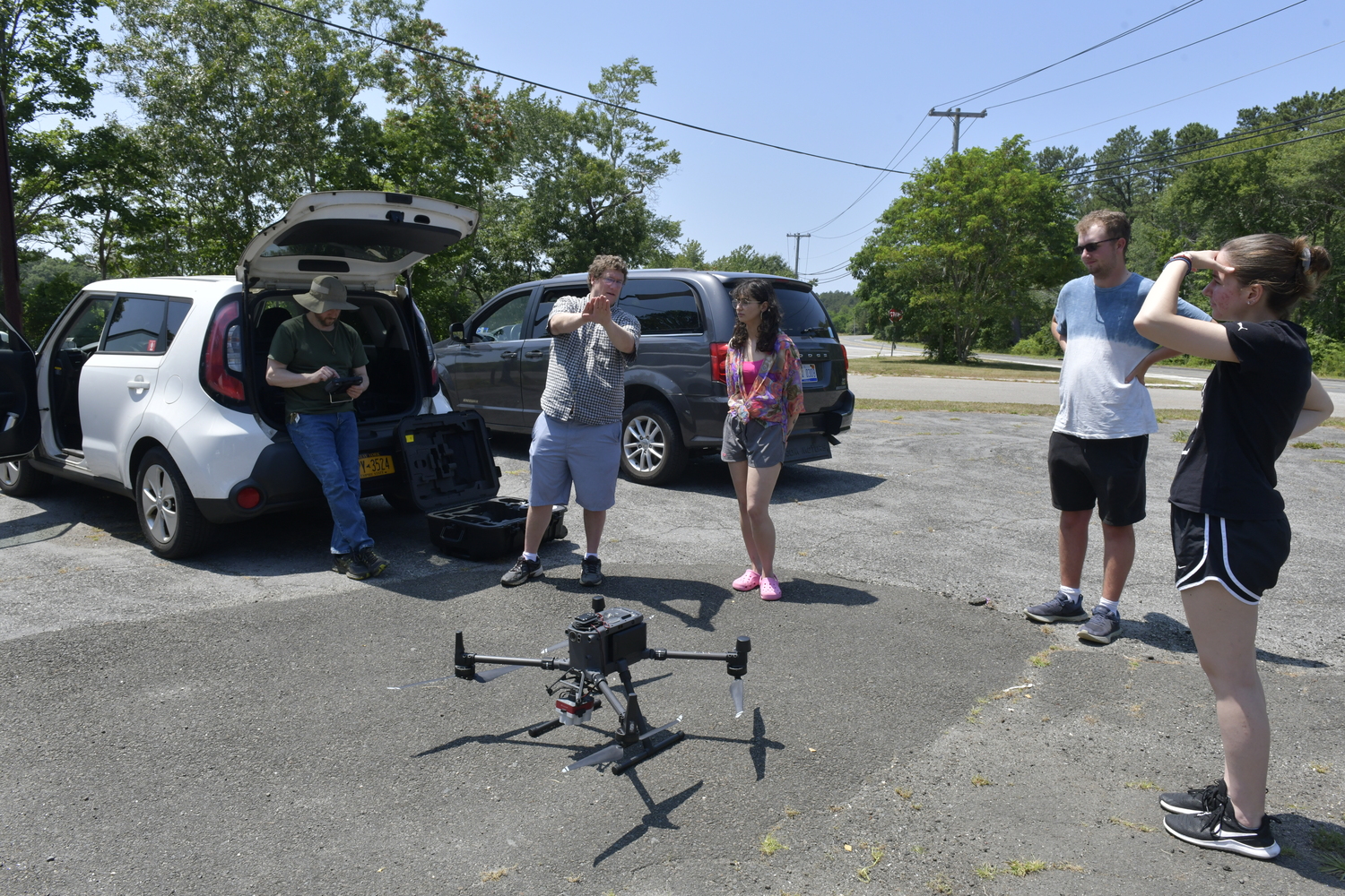 Farmingdale College geospatial science professor John Gross explains the plan to fly a drone over Wildwood Lake to students.   DANA SHAW