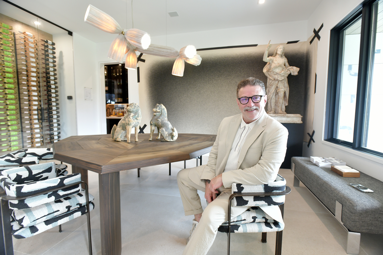 Gil Melott in his high-concept dining room at Holiday House Hamptons.  DANA SHAW