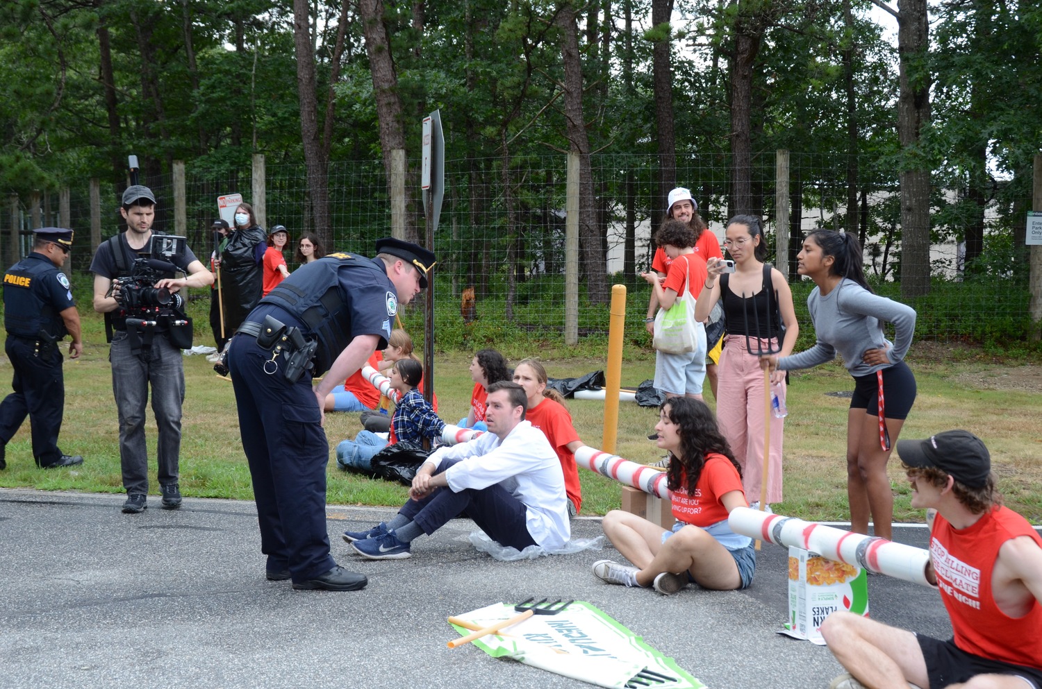 Protesters attempted to block access to East Hampton Airport on Friday afternoon, to protest the outsized contribution that private aircraft usage has on climate change.   KYRIL BROMLEY