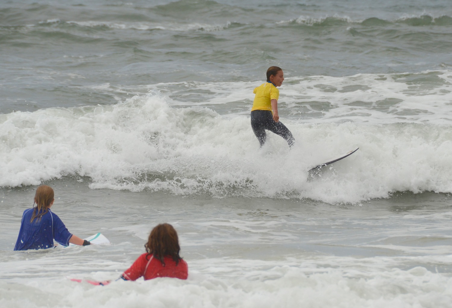 Surfers enjoy the waters at Ditch Plains.   KYRIL BROMLEY