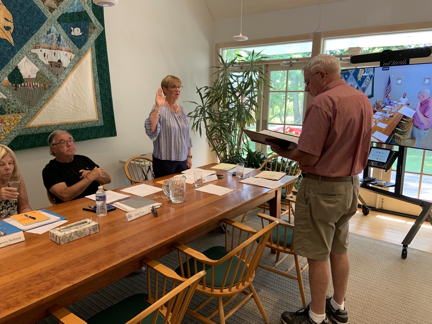 Trustee Terie Diat takes the oath of office at the North Haven Village Board's organizational meeting on July 5. STEPHEN J. KOTZ