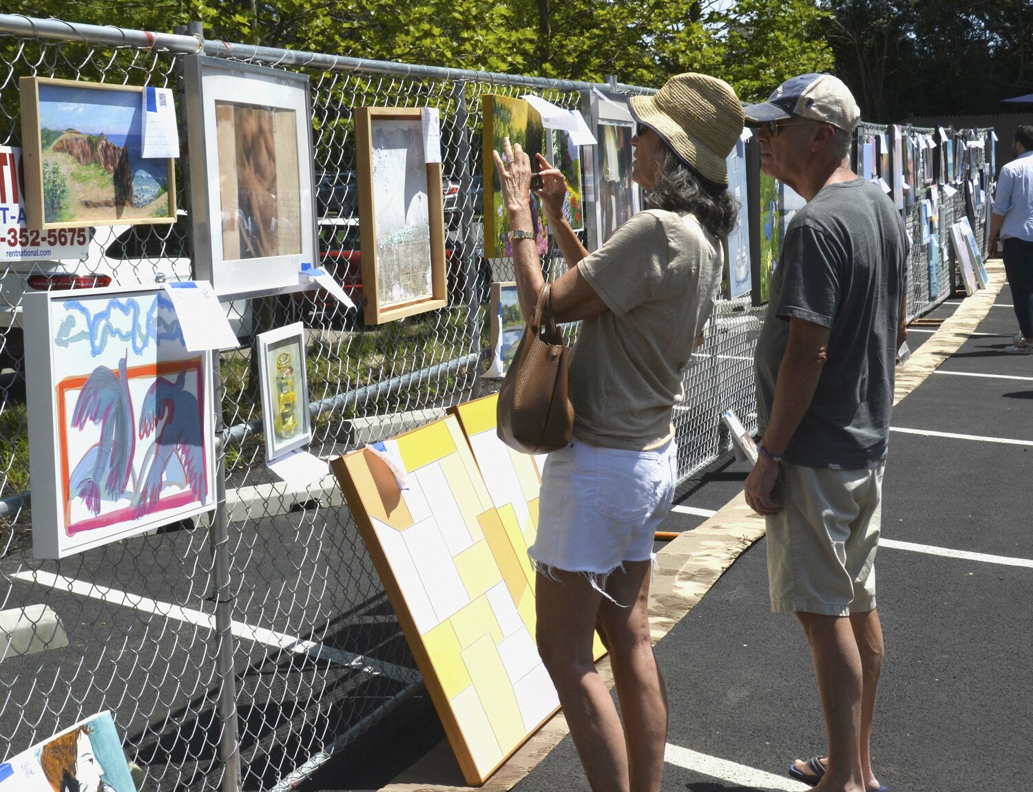 Guild Hall hosted its annual Clothesline Art Sale on Saturday featuring the work of local artists. The 2023 Clothesline Art Sale is dedicated in memory of Barbara McClancy, a longtime volunteer who was the heart and soul of the event.   KYRIL BROMLEY