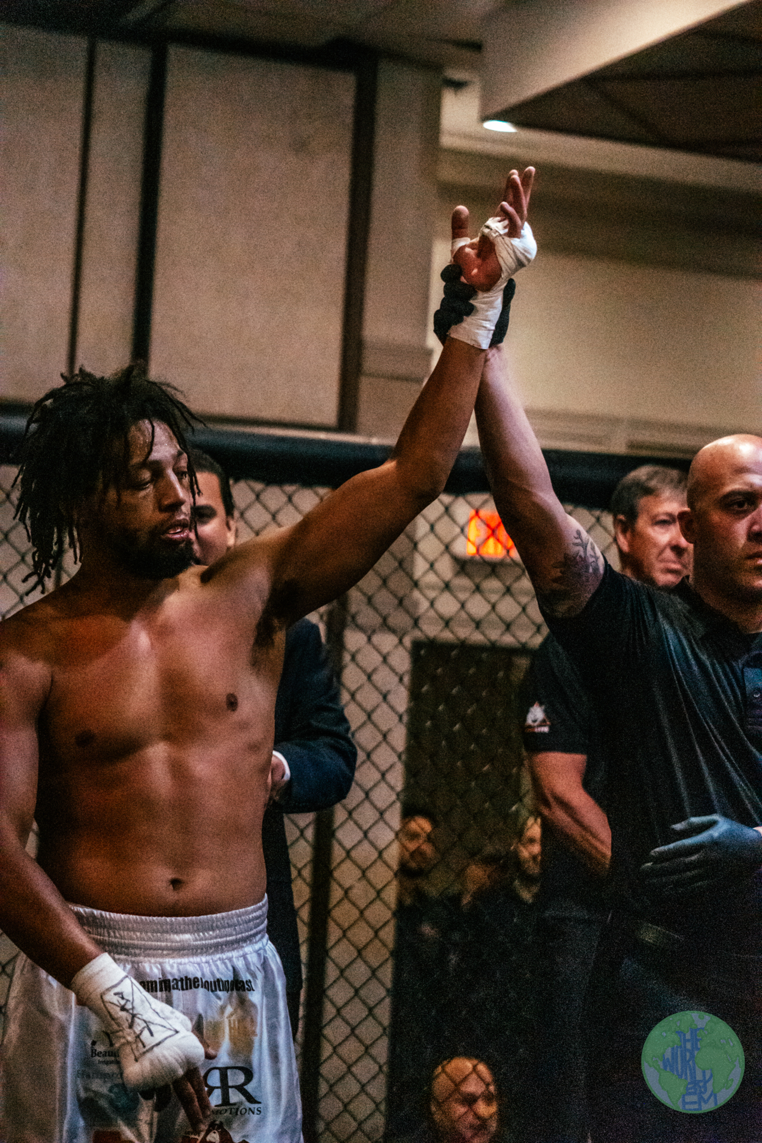 Neko Gettling gets his arm raised after winning his third professional MMA fight on July 1.   THE WORLD BY EM