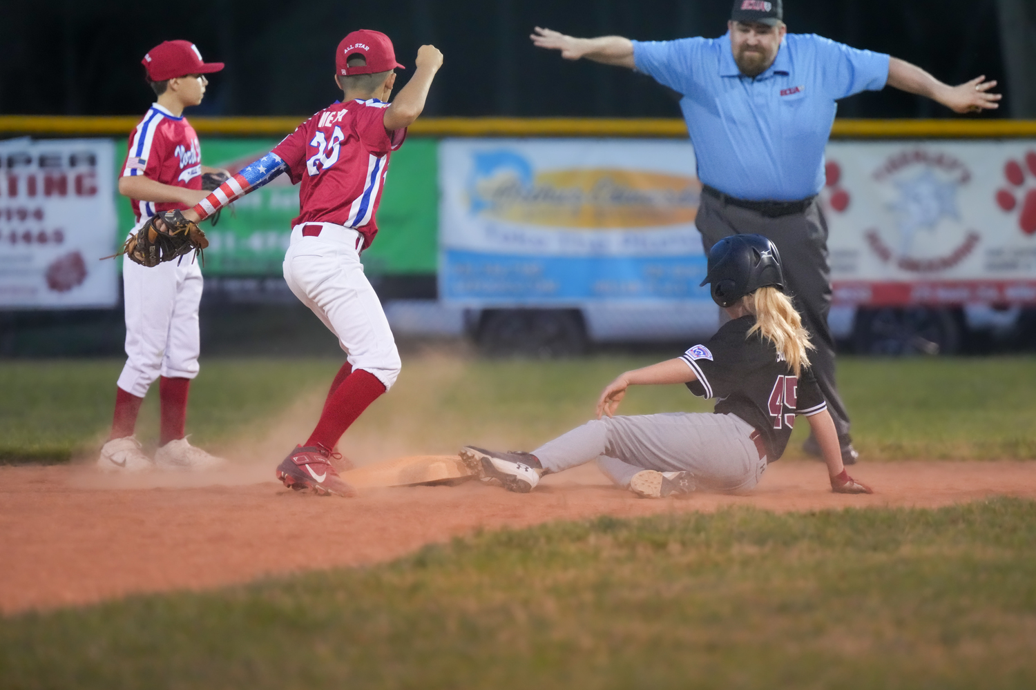 Cayden Sokol slides in safely ahead of the throw at second base.  RON ESPOSITO