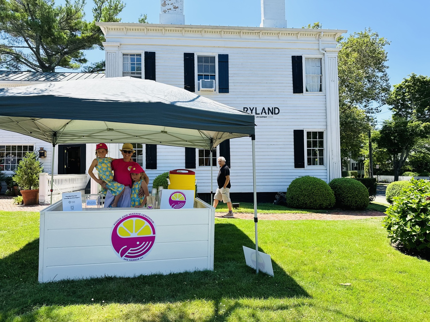 Fiona and Maeave Scissons set up shop outside of Ryland on Main Street in Sag Harbor.