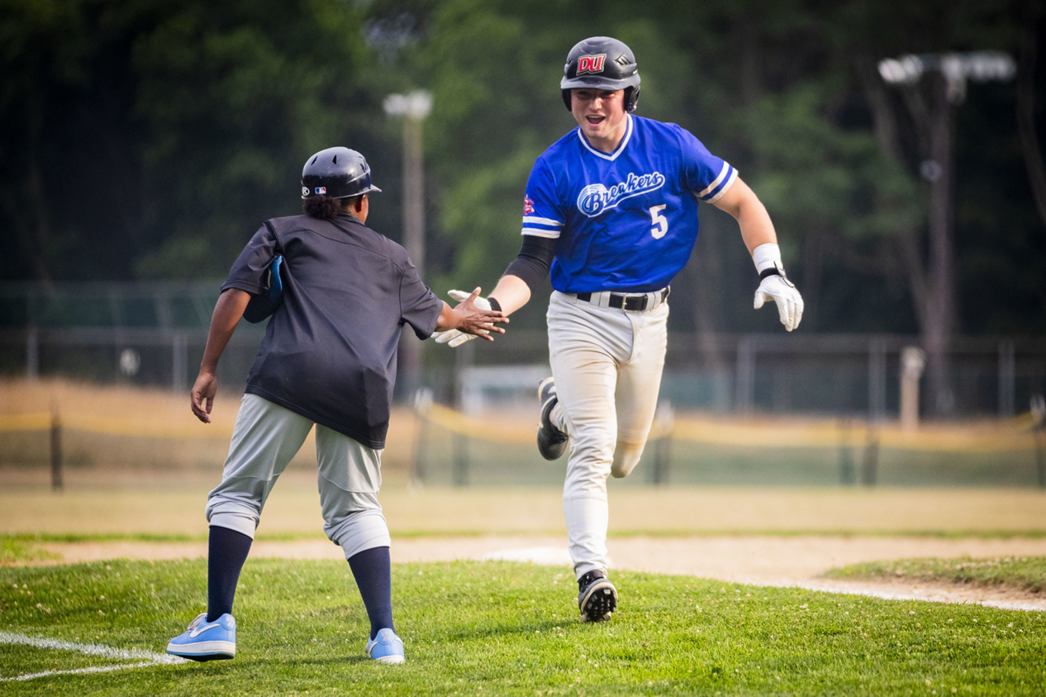 Southampton Breaker Ty Gilligan is pumped up as he rounds third base and heads home on his two-run homer that tied the game at 9-9 in the ninth inning.   DEMETRIUS KAZANAS