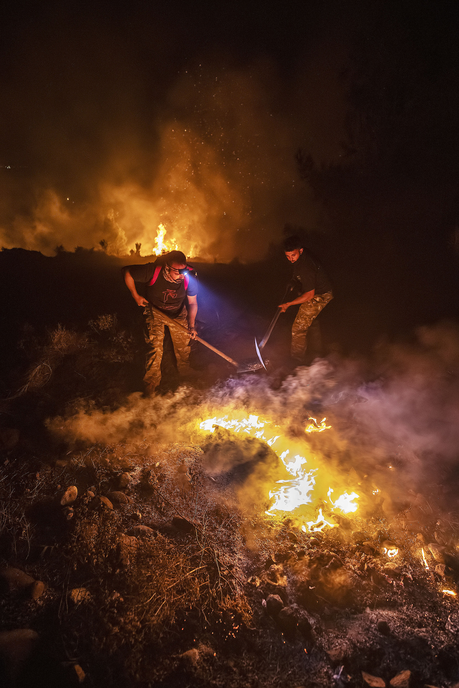 Firefighting efforts have been complicated by strong winds, an often short-handed municipal fire service, and the lack of a central organizing system for volunteers who are eager to help.