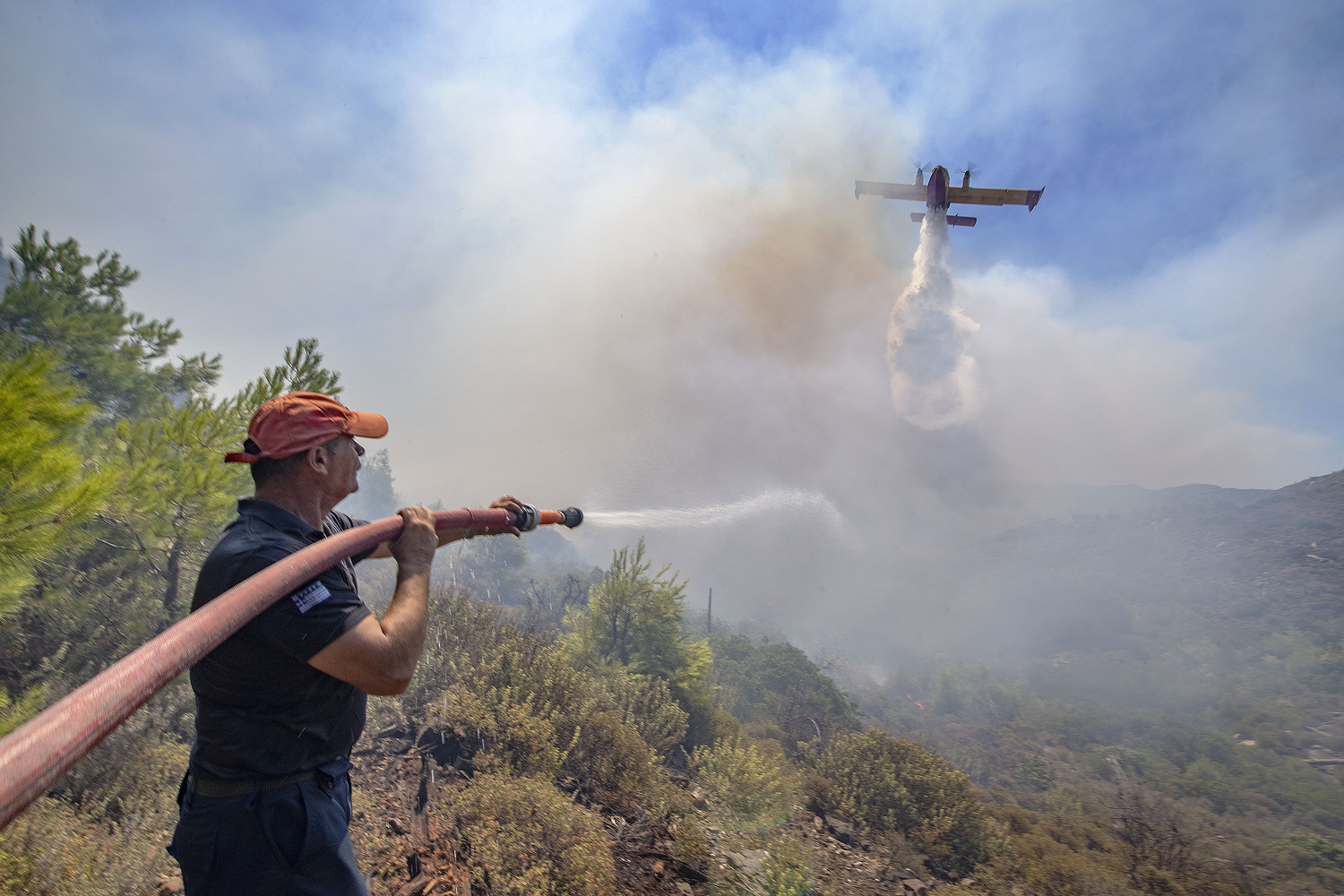 Former Express photographer and East Hampton Fire Department member Michael Heller, who now lives in Greece, has been aiding firefighting efforts on the Greek Island of Rhodes, where wildfires have destroyed villages and forced the evacuation of 19,000 tourists in recent days. MICHAEL HELLER PHOTOS
