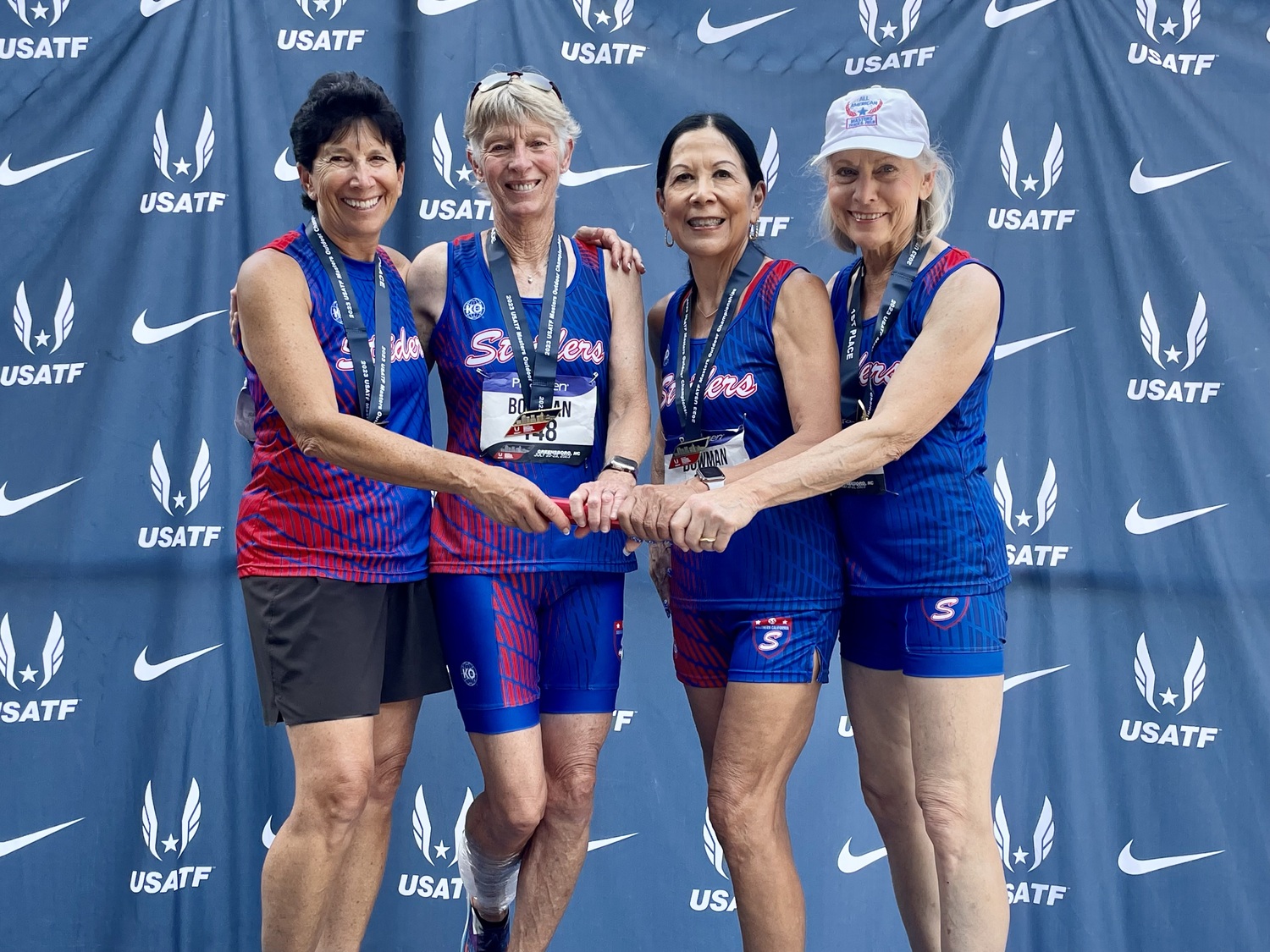 Photo of Joy Flynn, far right, with her teammates of the winning  4x100-meter relay team that set a national age-group record in the 70-74 division.  Flynn runs for the Southern California Striders Track Club.