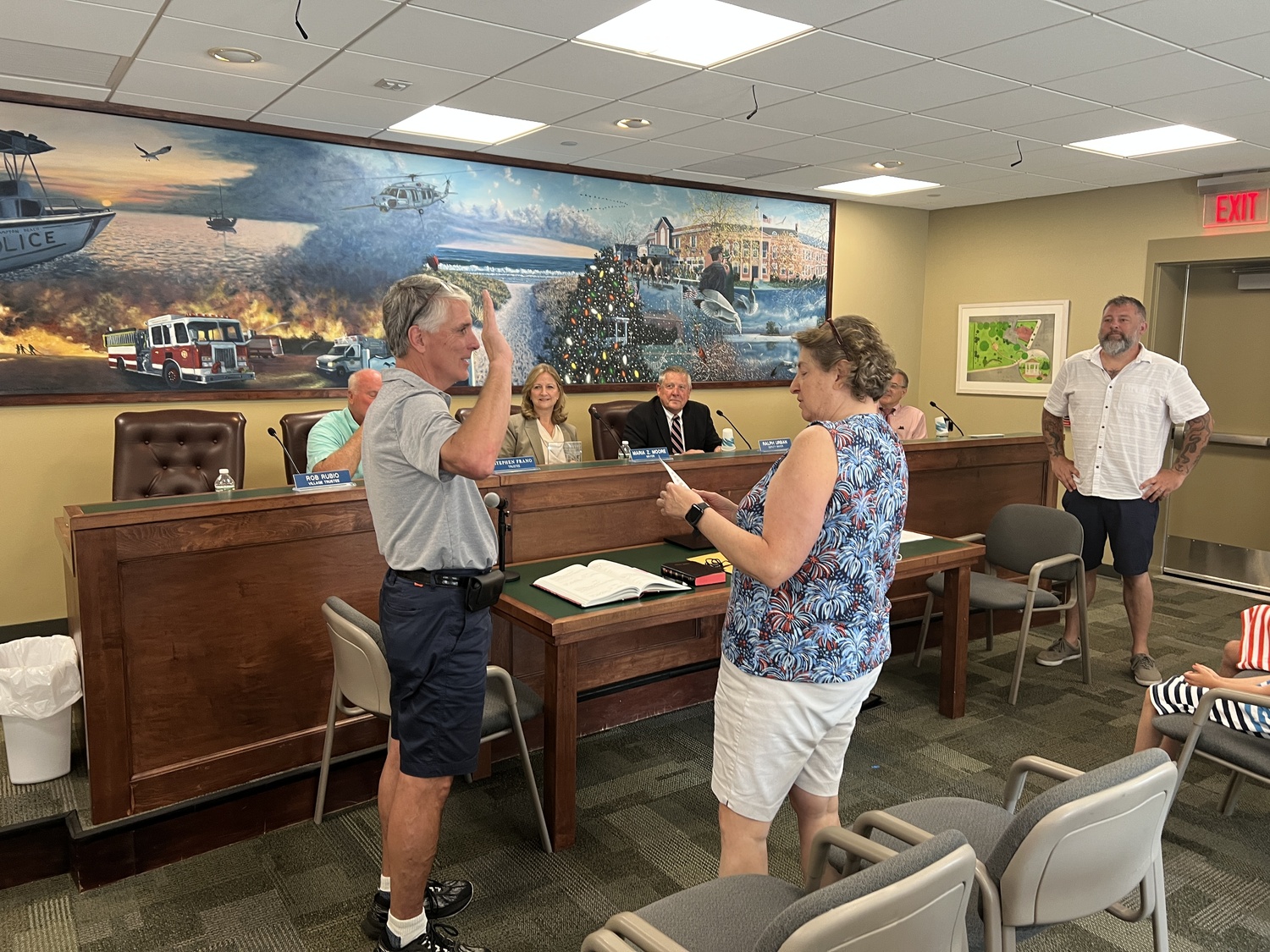 Trustee Rob Rubio is sworn in by Village Clerk Elizabeth Lindtvit on July 3. BILL SUTTON