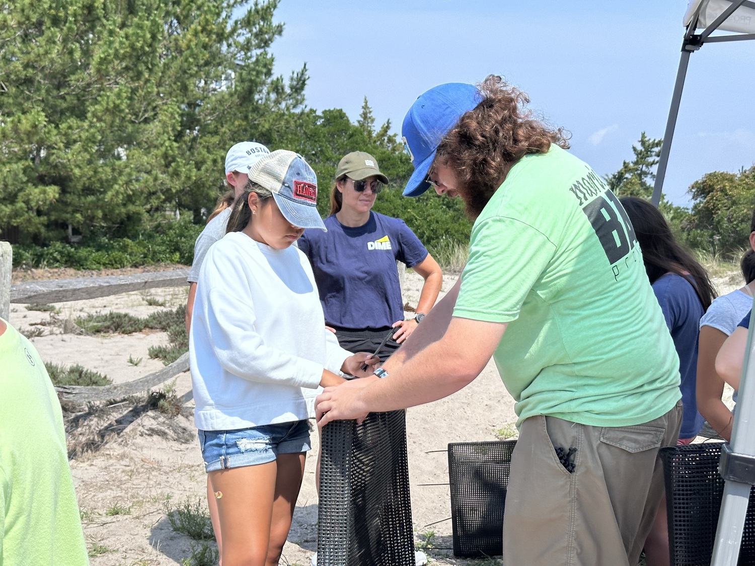 Participants build oyster habitats. JOHN PAUL FERRANTINO