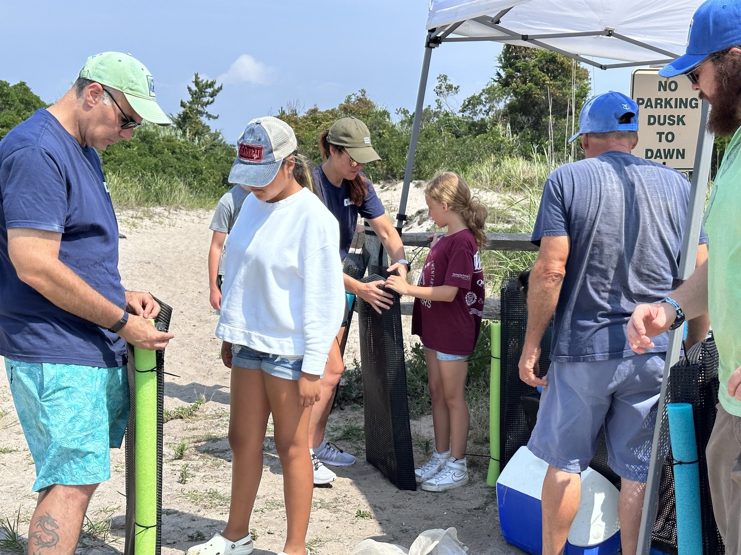 Participants build oyster habitats. JOHN PAUL FERRANTINO