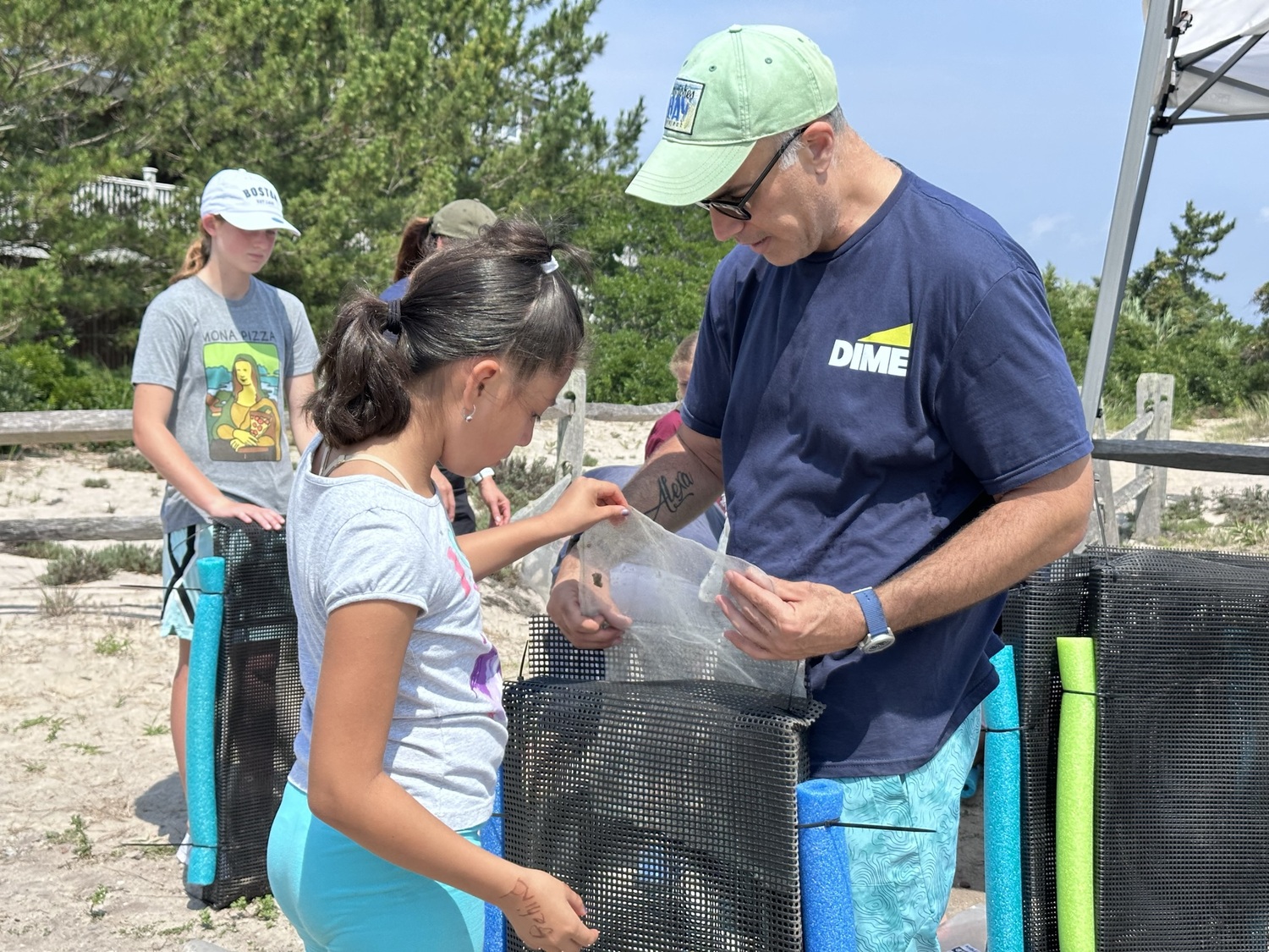 Participants build oyster habitats. JOHN PAUL FERRANTINO