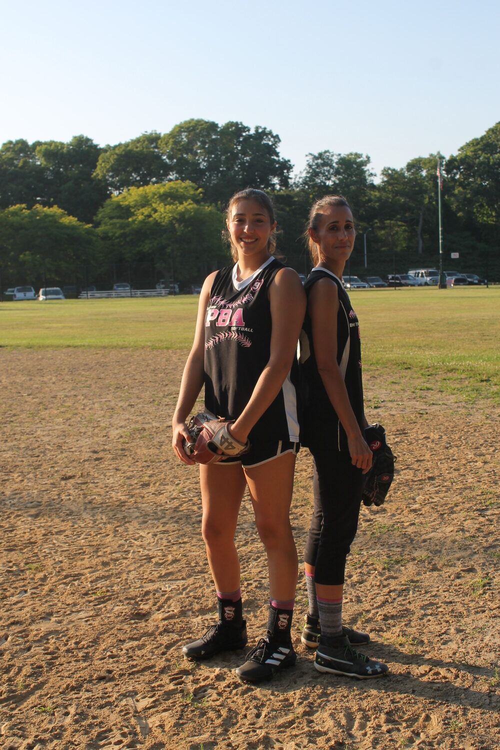 Emma and Julie Terry now play on the East Hampton PBA women's softball team together.   JEN VINSKI