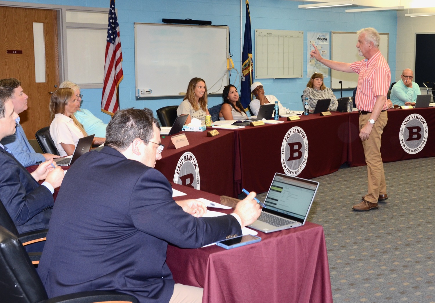 Hampton Life magazine owner Kirby Marcantonio presents East Hampton's board of education with an affordable housing plan during its July 11 meeting. KYRIL BROMLEY