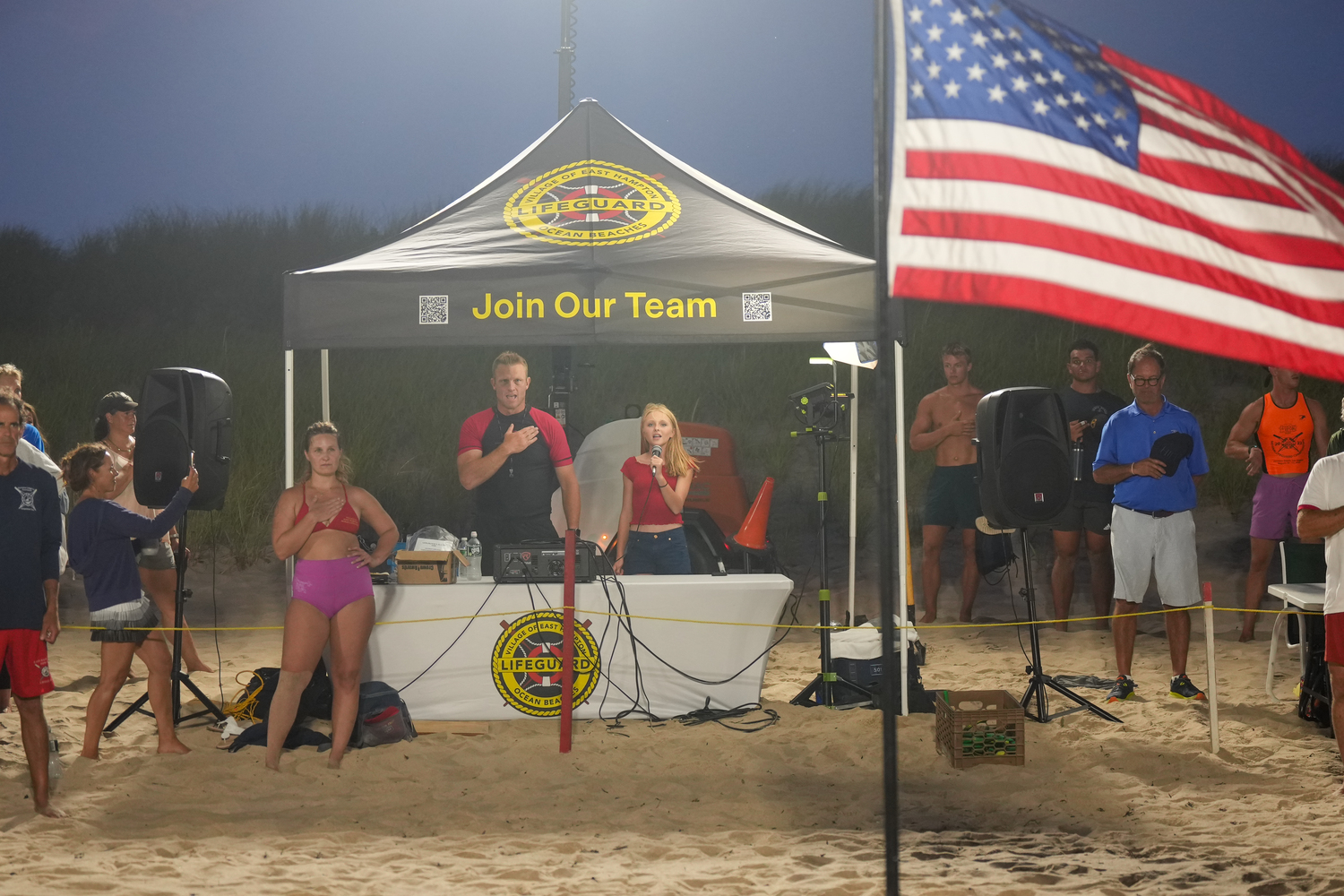 Rising freshman at East Hampton High School Emma Hand sings the national anthem before the main event, beach flags, on Thursday night.   RON ESPOSITO