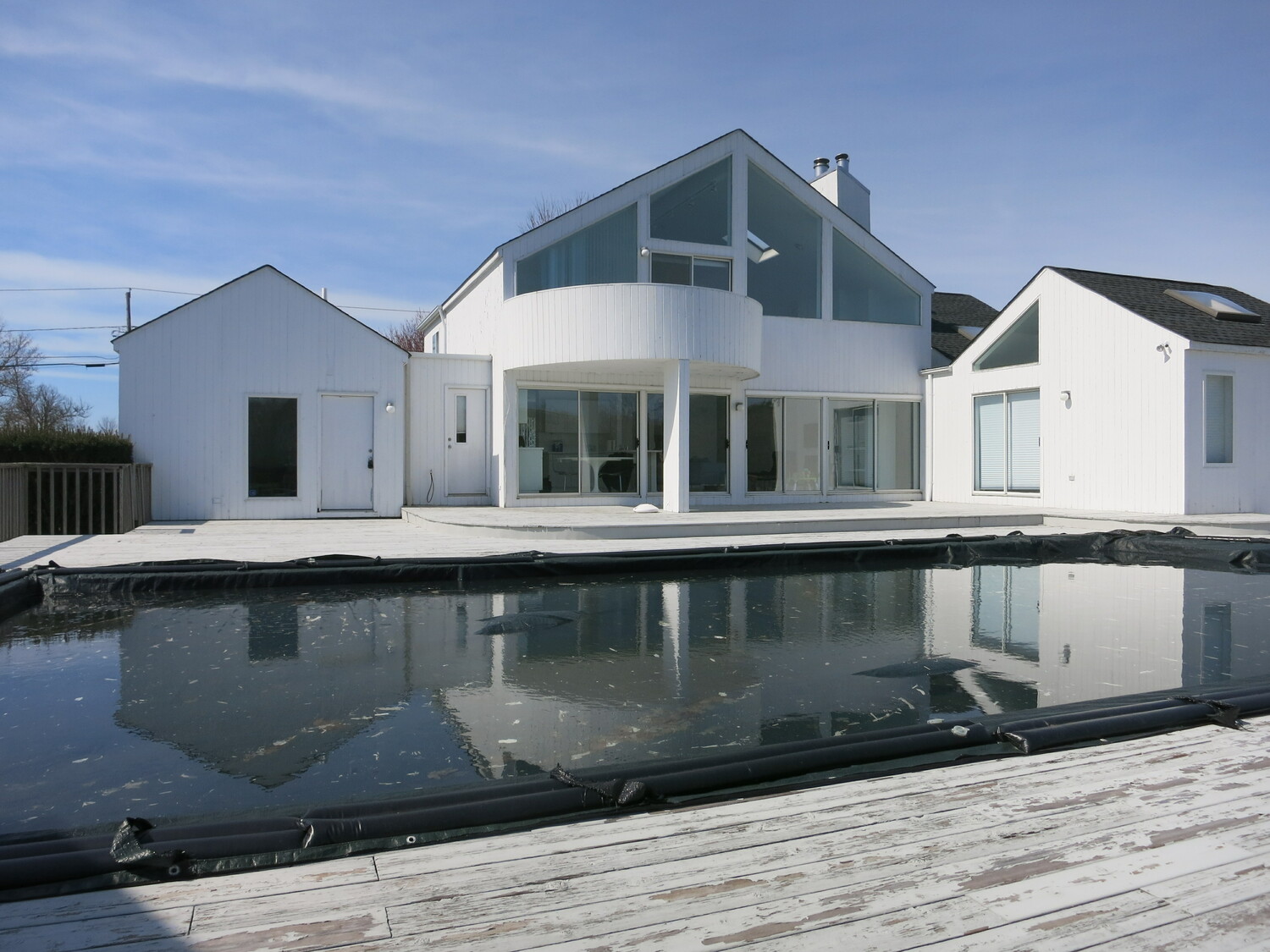 A view of the rear of the house at 325 Mitchell Lane in Bridgehampton before a top-to-bottom renovation project. RYAN SCOTT FITZGERALD