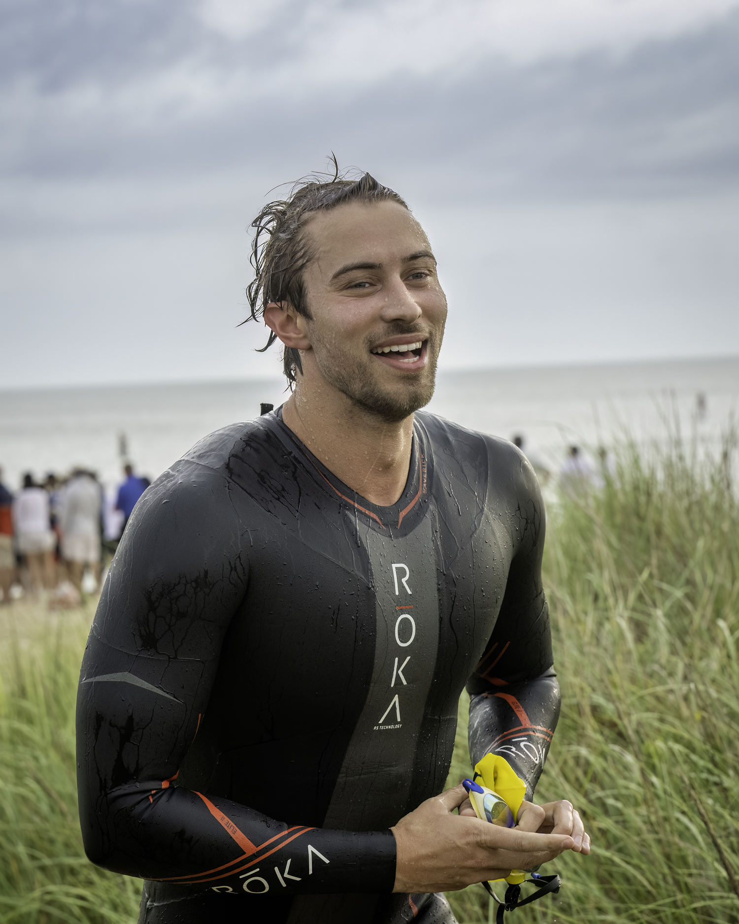 A triathlete gets out of the water.   MARIANNE BARNETT