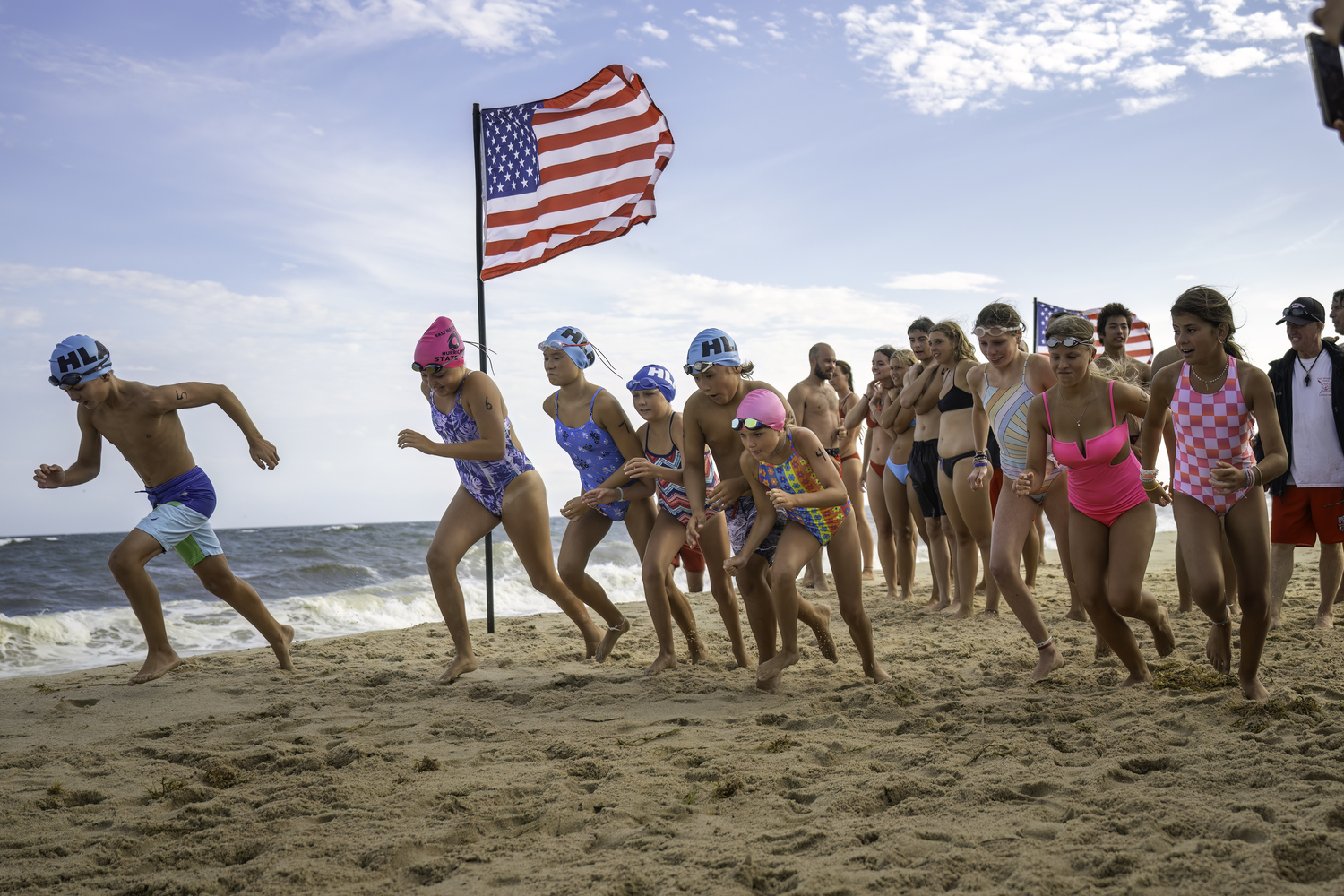 The Hampton Lifeguard Association held its second annual Run-Swim-Run on Friday at Atlantic Avenue Beach in Amagansett to help defray the cost of its lifeguards heading to the USLA Nationals next month.    MARIANNE BARNETT