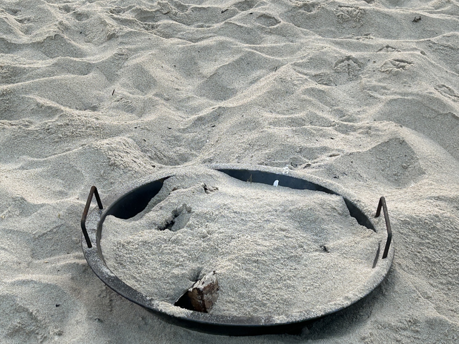 Use a metal container? Yes. Leave on the beach? No. The Towns of East Hampton and Southampton both have regulations when it comes to beach fires.    KITTY MERRILL