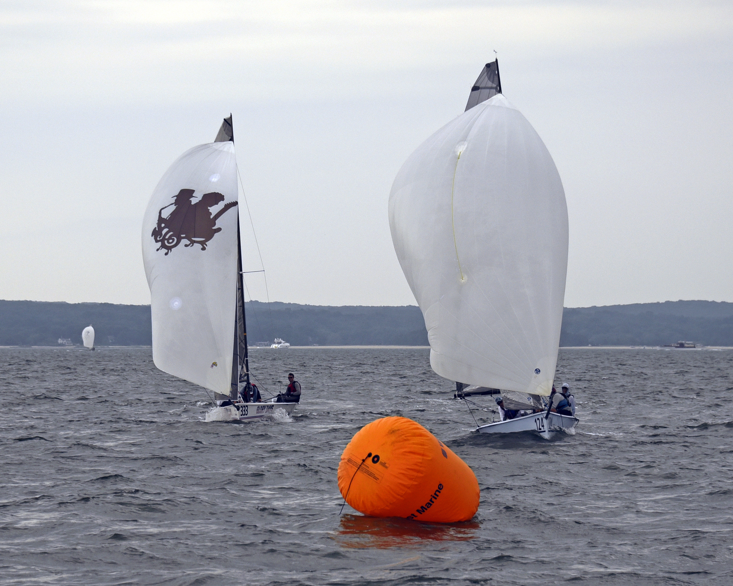 Minutes before the clouds parted and rain came down in sheets, first place in Spinnaker Division 2 Viper Glory Days, left, in a mortal duel with second place Viper Zorro.   MICHAEL MELLA