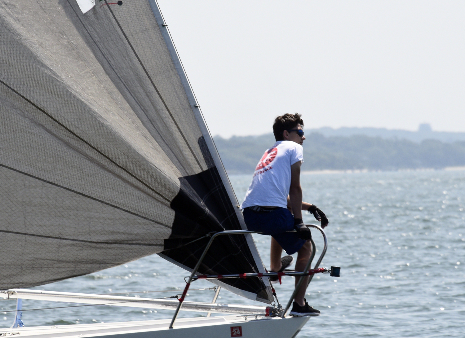 Lunatic Fringe’s lookout foredeck crewmember at the start. Peter Lehnert’s yacht placed first in the non-spinnaker division and went on to being awarded top honors in the 22-yacht regatta.   MICHAEL MELLA