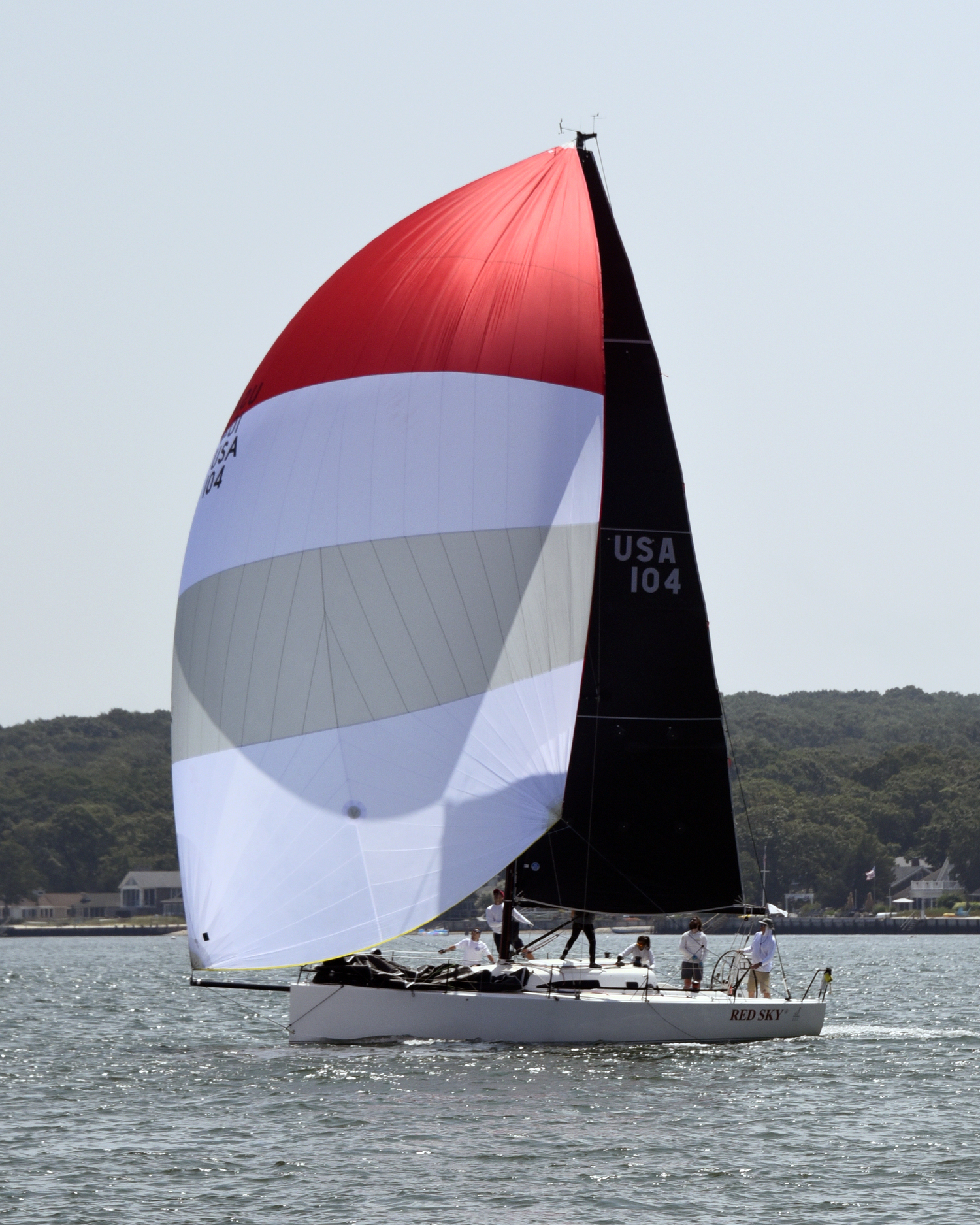 John Pearson’s Red Sky flying her kite to a first place win in Spinnaker Division 1.    MICHAEL MELLA