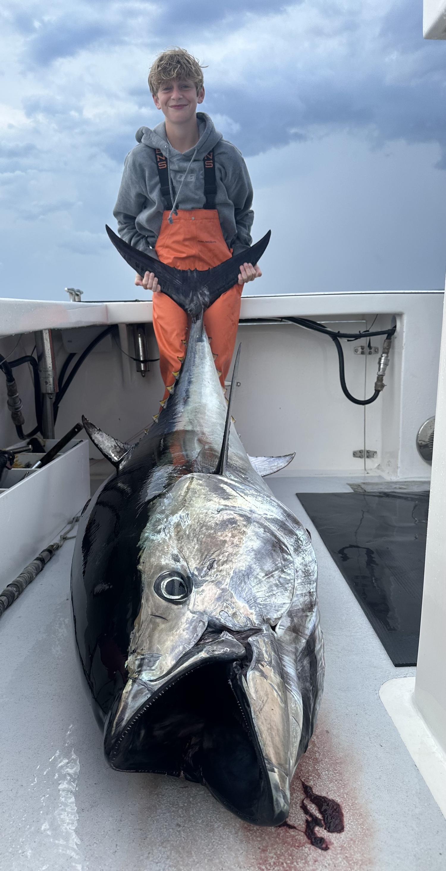 Braydan Fromm with a giant bluefin tuna caught while fishing with his dad aboard the Flying Dutchman.