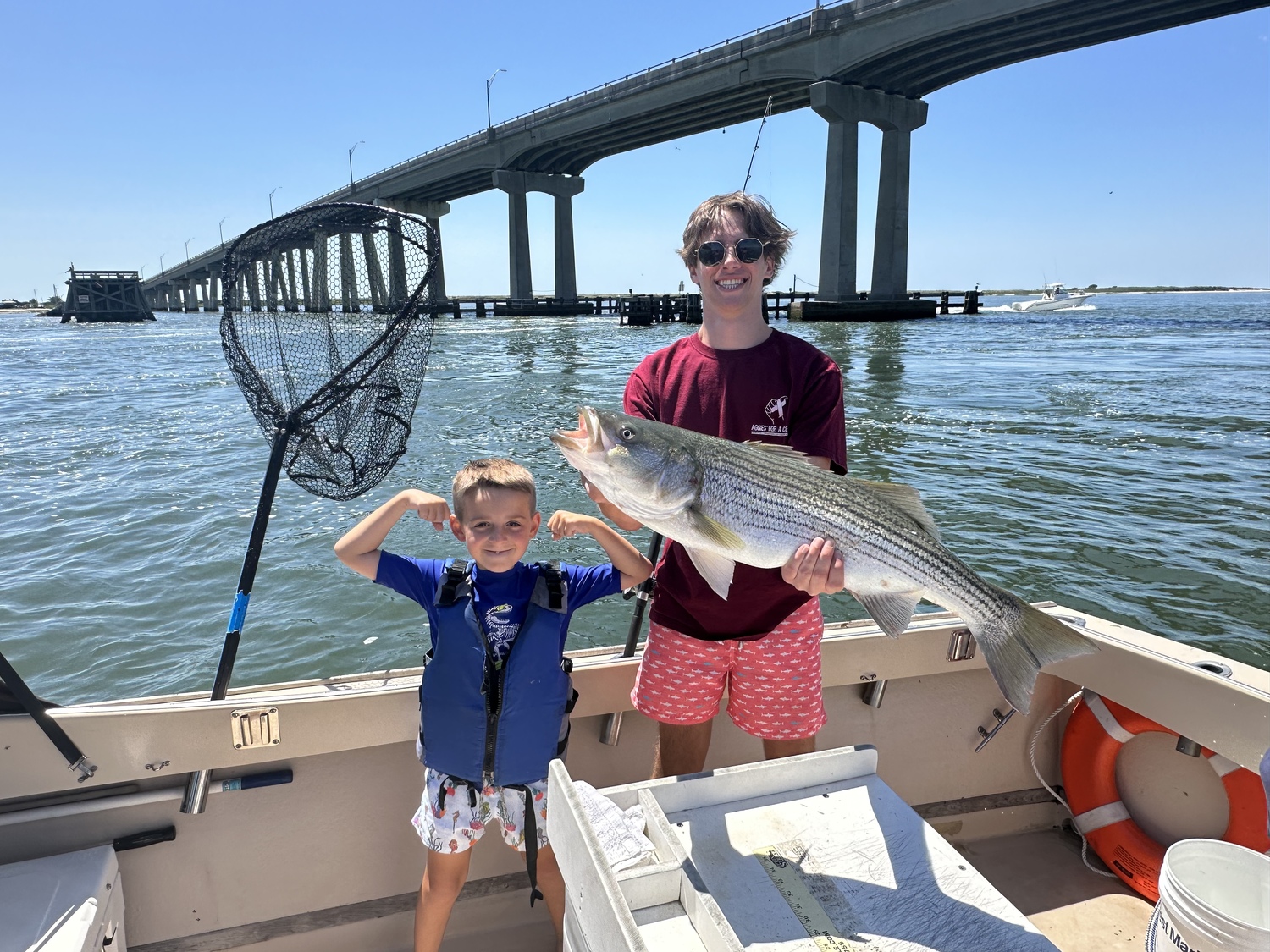 Regulators began meeting this week to craft new rules for striped bass fishing. The emergency slot limit reduction this year made striped bass like this one caught by Chris and Fletch Wilkinson aboard Capt. Brad Ries's charter boat Someday Came somewhere in Hampton Bays too big to keep.  CAPT. BRAD RIES