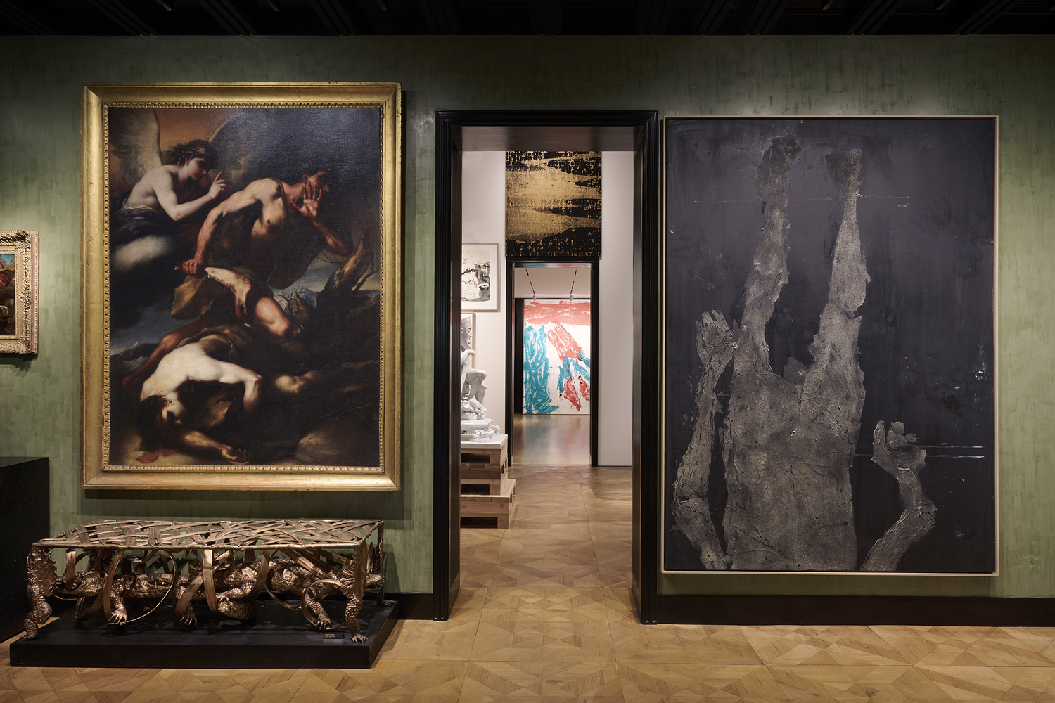 Luca Giordano, Cain and Abel, circa 1660s, Oil on canvas; Claude Lalanne, Crocodile Bench, 2009
Bronze; Georg Baselitz, Am Geländer herunter, 2017, Oil on canvas.
The green gallery walls are finished in a green venetian plaster. JASON SCHMIDT