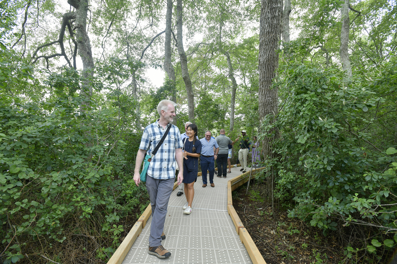 Kevin Munroe, Long Island Preserves Director for the Nature Conservancy  leads a tour of the of a new universal access trail at Wolf Swamp Preserve in North Sea on August 24. The new half-mile loop is designed and built per federal accessibility guidelines that can accommodate strollers, wheelchairs, and visitors with other mobility needs or challenges. Big Woods and Wolf Swamp Preserve are open 7 days a week from sunrise to sunset and are free.    DANA SHAW