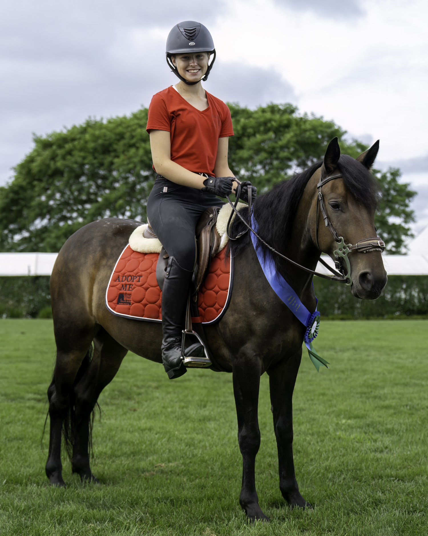 Emily Robertson with Abracadabra, a mustang from Rising Starr was adopted.   MARIANNE BARNETT