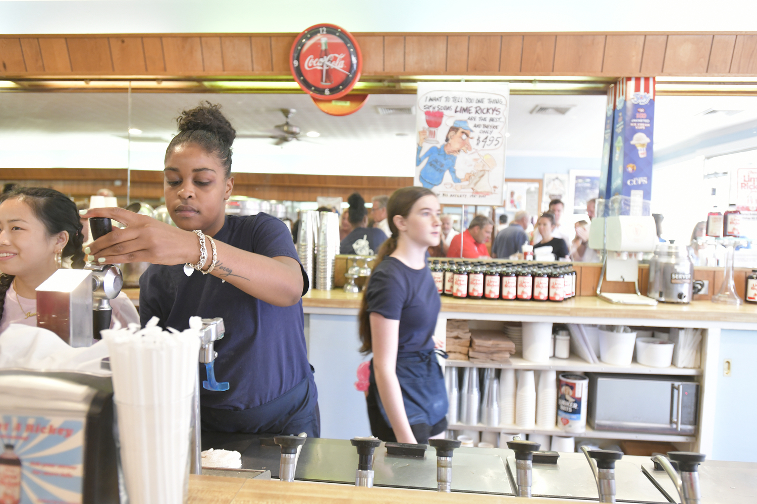 Nyah Harmon prepares Lime Rickey's for guests at Sip'n Soda on August 3 for the launch of the Cherry Lime Rickey syrup.  DANA SHAW