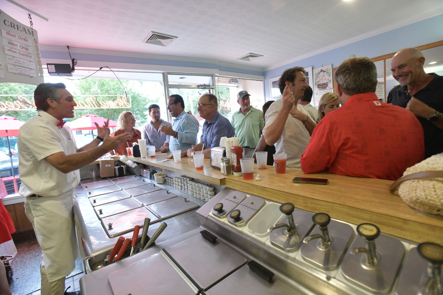 Mark Parash, owner of Sip’n Soda, chats with guests at the launch of the Cherry Lime Rickey syrup on August 3.     DANA SHAW