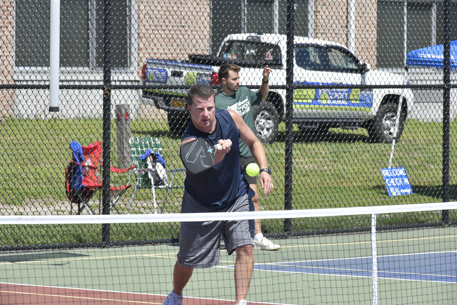 Russ Bank makes a play during the pickleball tournament at Hampton Bays High School on Saturday.  DANA SHAW