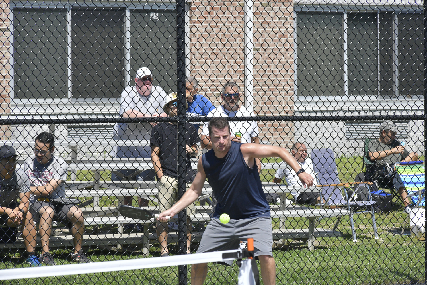 Russ Bank makes a play during the pickleball tournament at Hampton Bays High School on Saturday.  DANA SHAW