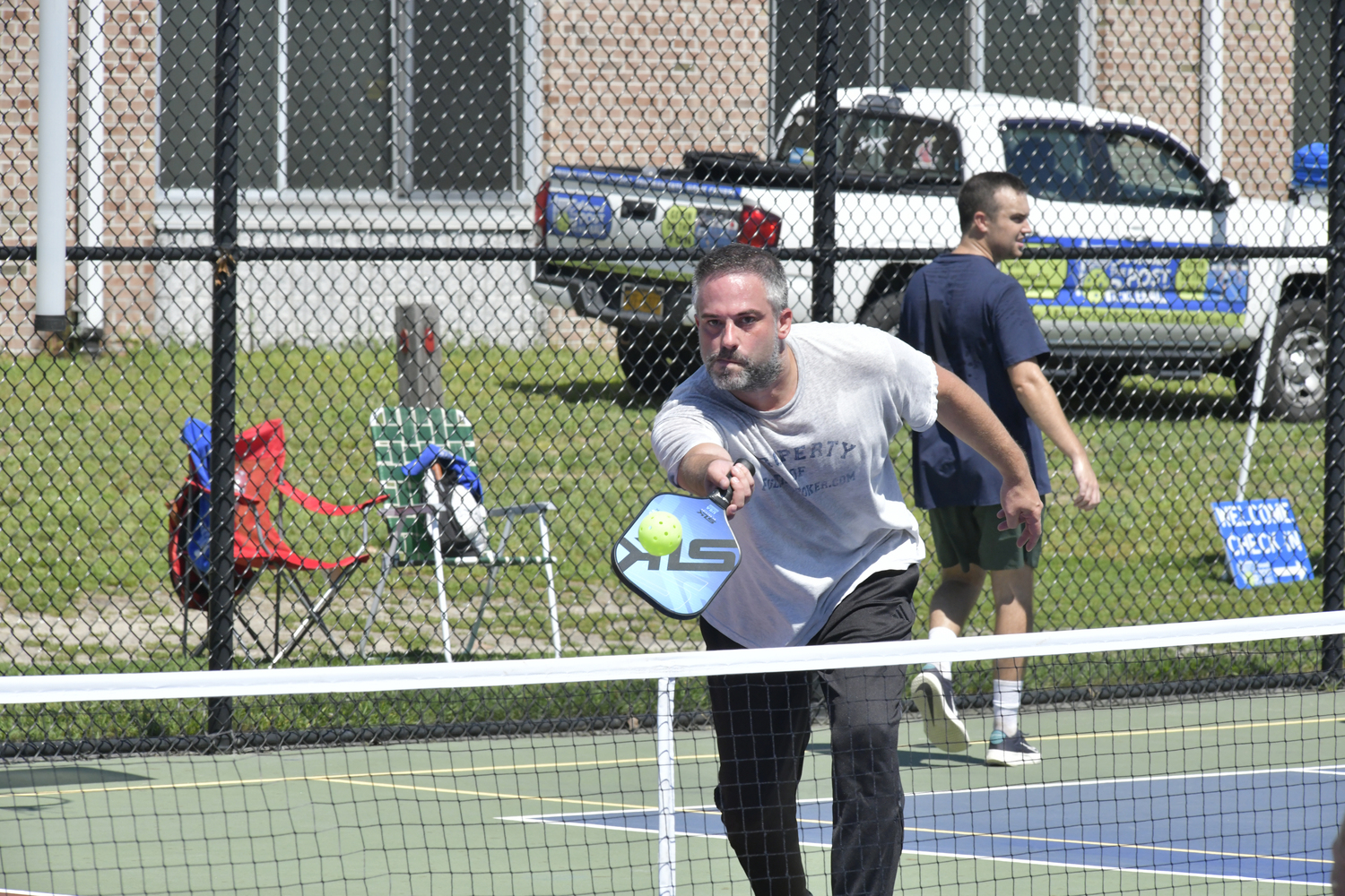 Jason Rosengarten returns during the pickleball tournament at Hampton Bays High School on Saturday.  DANA SHAW