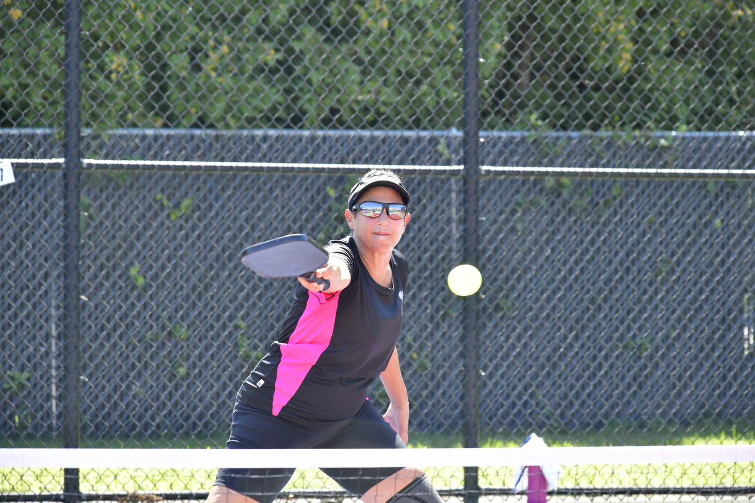 Lisa Granucci returns during the pickleball tournament at Hampton bays High School on Saturday.  DANA SHAW