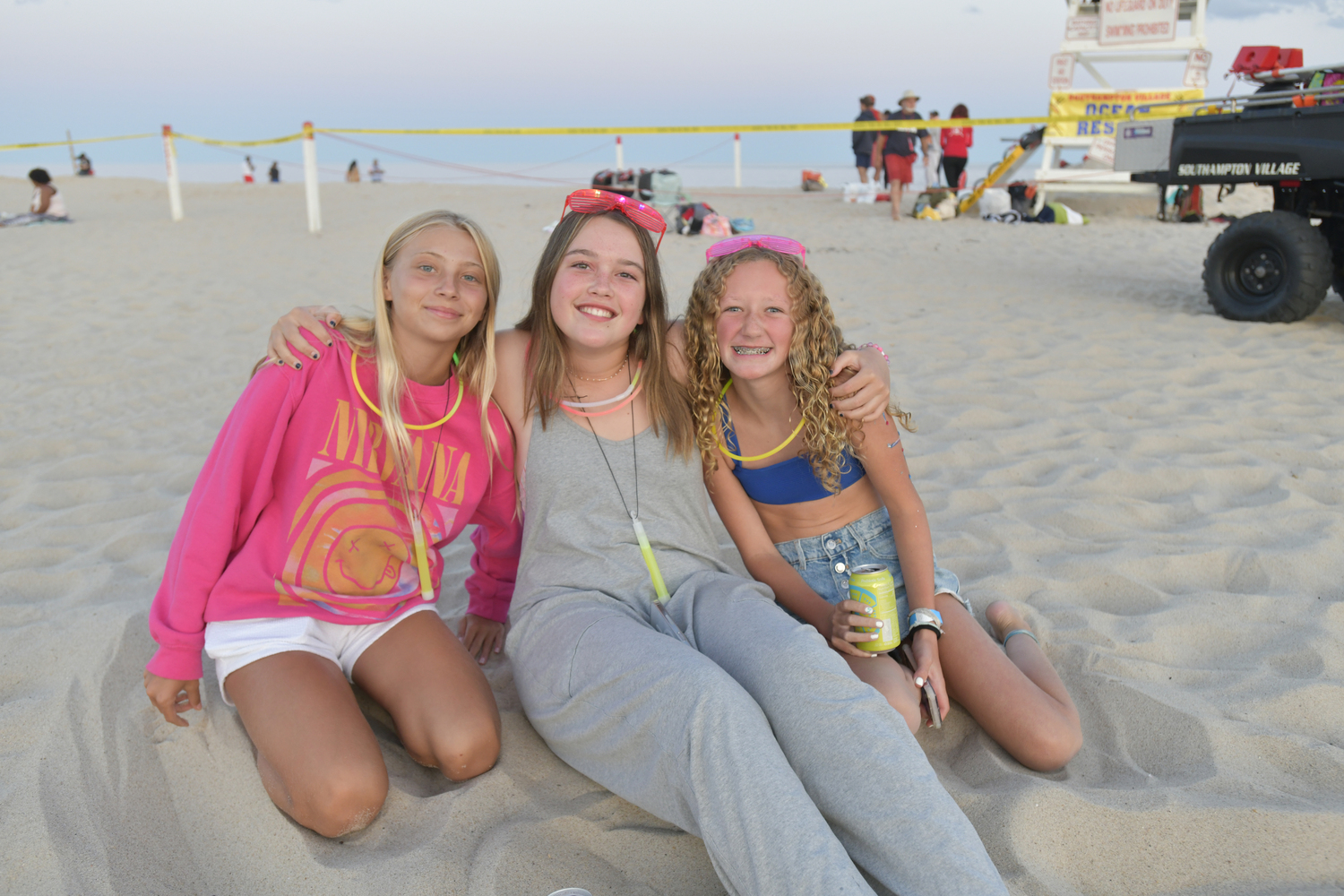 Evie Berkoski, Avery Greene and Tilly Ferran at the Moonlt Plunge for Heart of the Hamptons on Tuesday night at Coopers Beach.  DANA SHAW