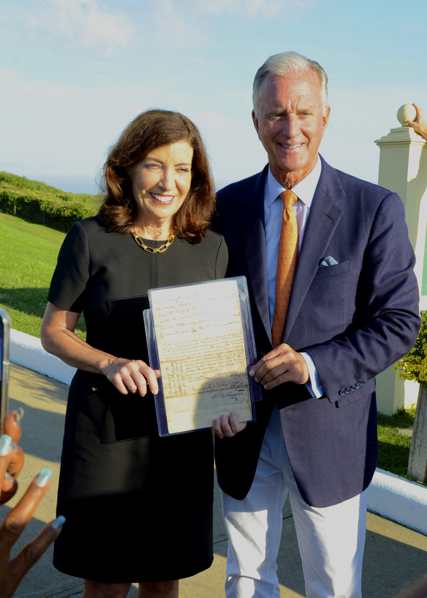 Governor Kath Hochul and Montauk Point Lighthouse Keeper Joe Gaviola with President George Washington's letter.  KYRIL BROMLEY