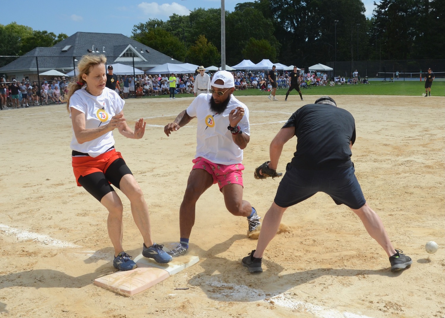 Tie goes to both runners? Lori Singer and a teammate are stuck at first base. KYRIL BROMLEY
