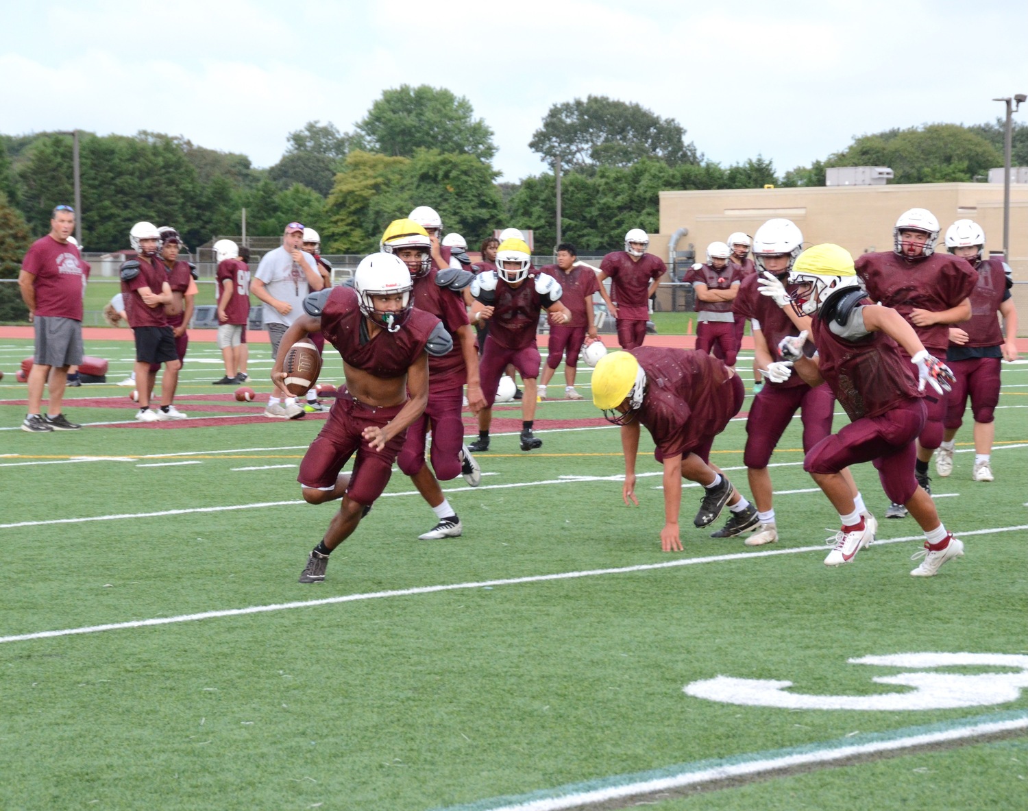 The Bonackers run through drills on Monday.   KYRIL BROMLEY