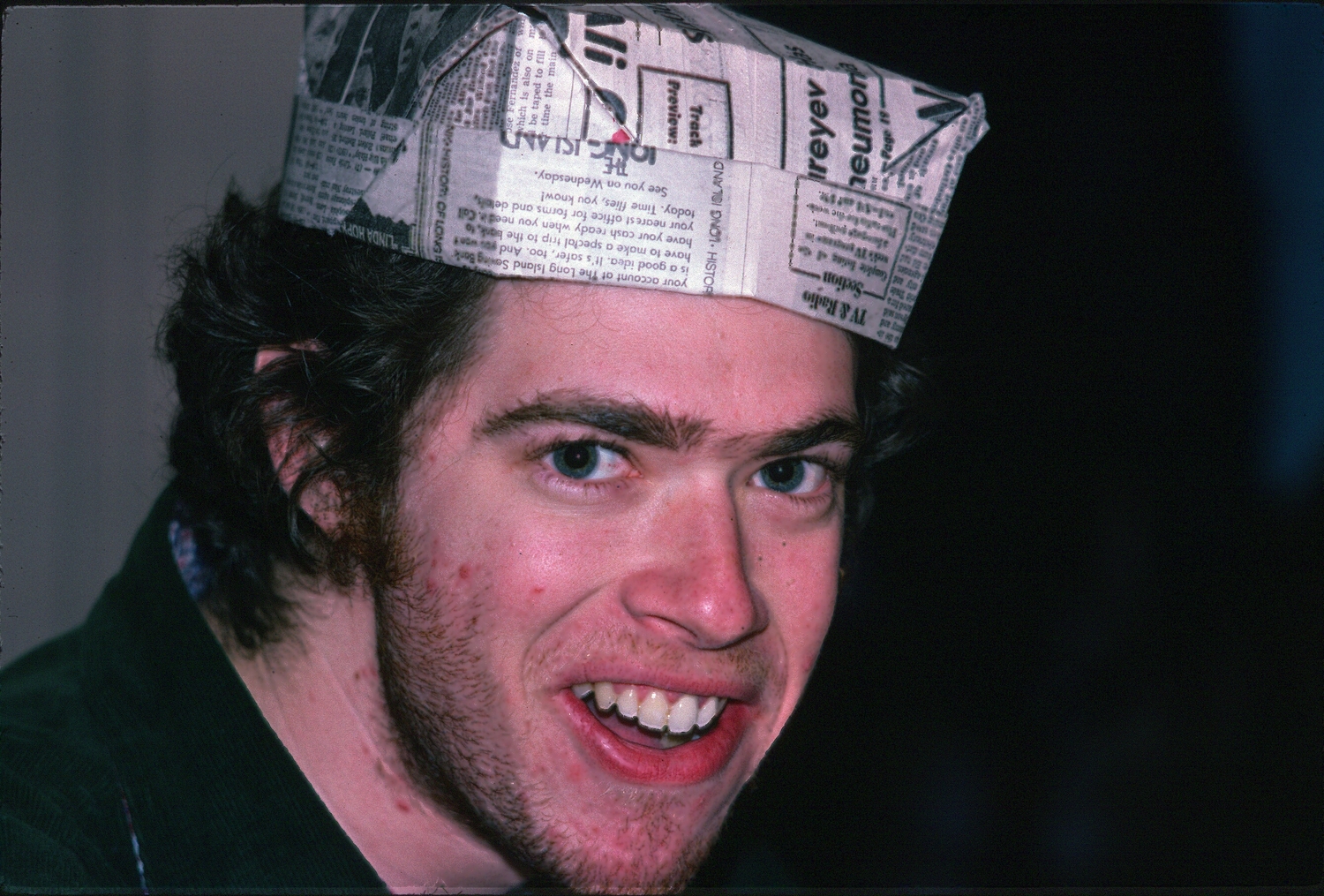 Doug Feiden wears a pressman's hat, which he made, 1978. COURTESY WAYNE FEIDEN