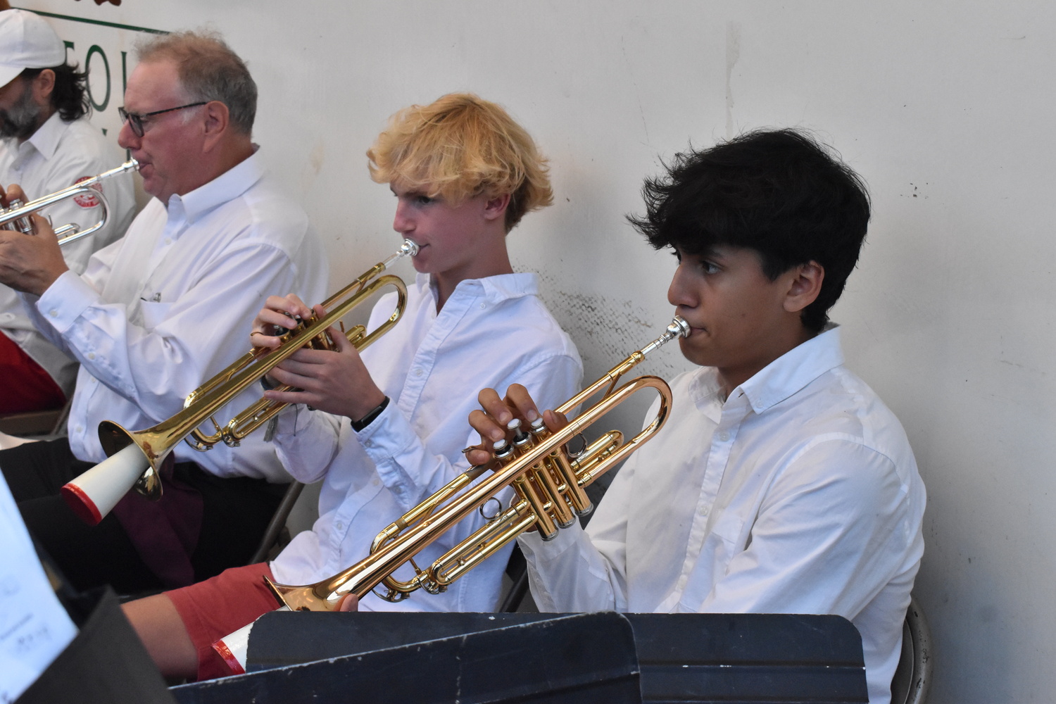 High school students Hewie Dunne, left, and Steven Ortiz, play trumpet in the Sag Harbor Community Band. STEPHEN J. KOTZ